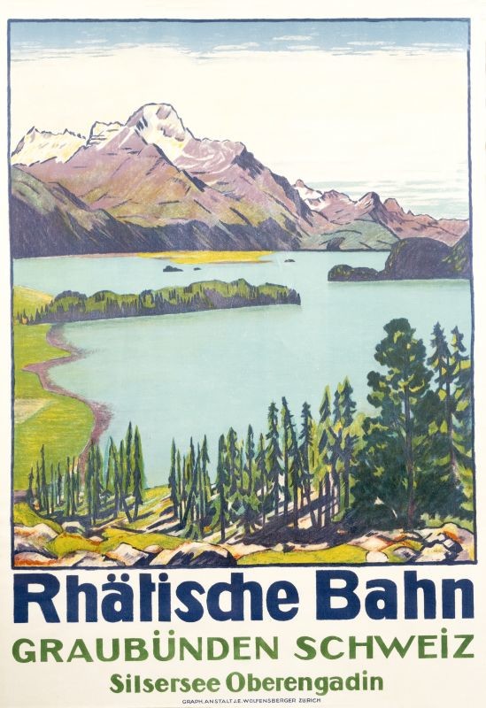 View of Lake Silser and mountains; blue, green, purple