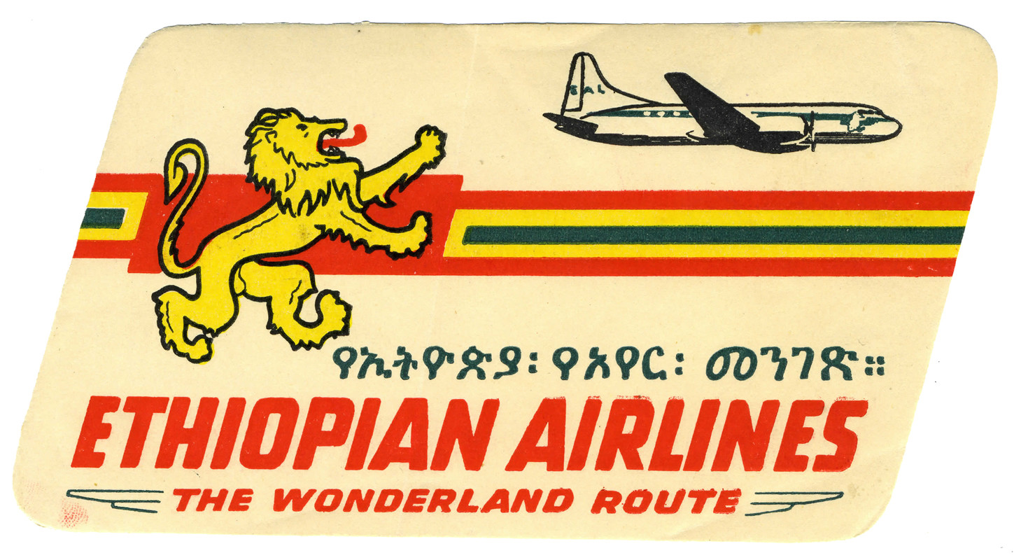 Lion logo with jet plane; green, red, yellow