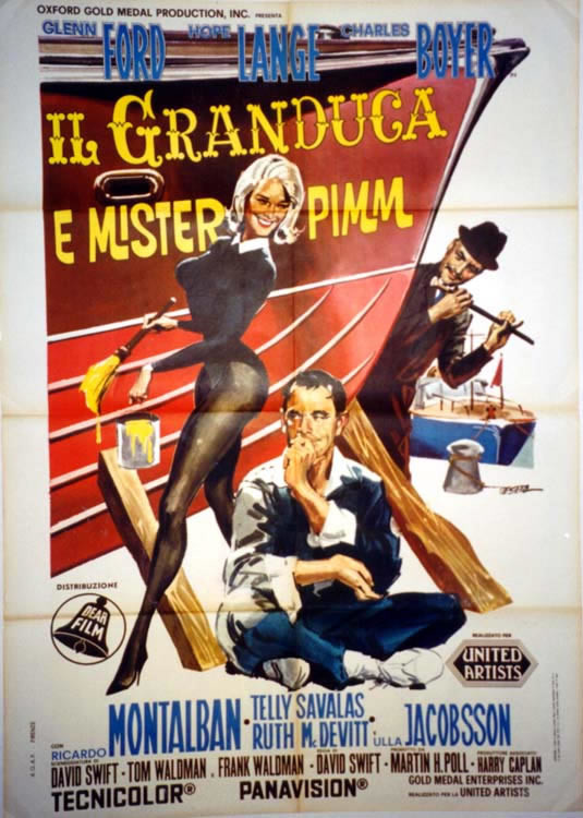 Cross-legged man sits in front of ship's prow with woman in leotard holding paintbrush Ricardo Montalban; red, beige, blue