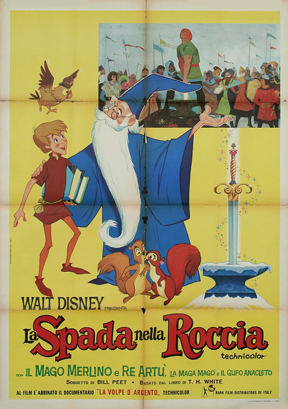 Merlin gestures to sword as he addresses Arthur; yellow, blue, red