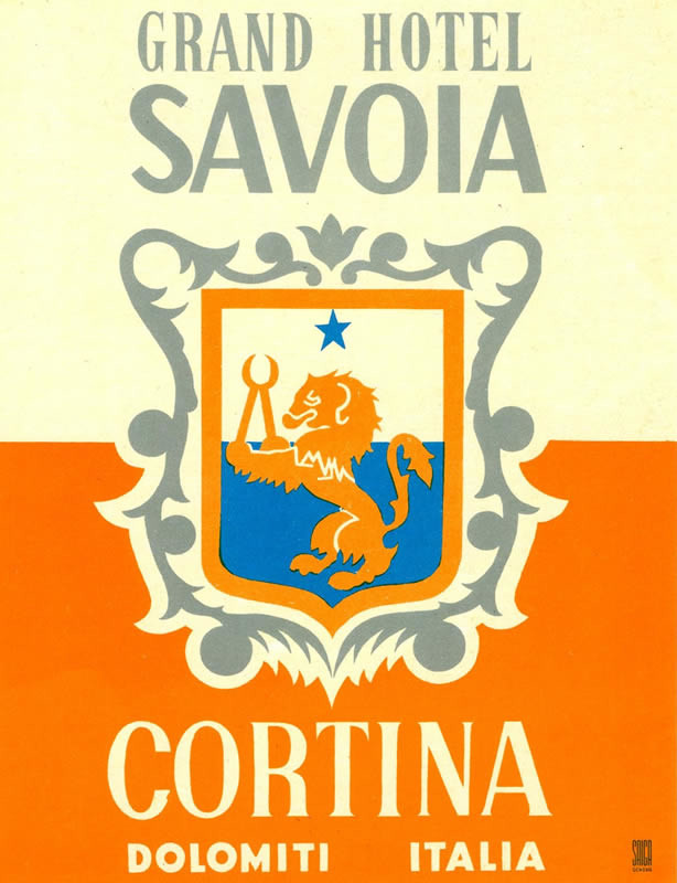 Crest with lion holding wrench with a single star above; orange, blue, silver