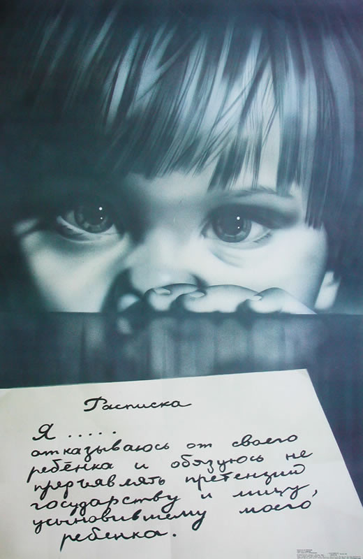 Face of child behind table; black, white
