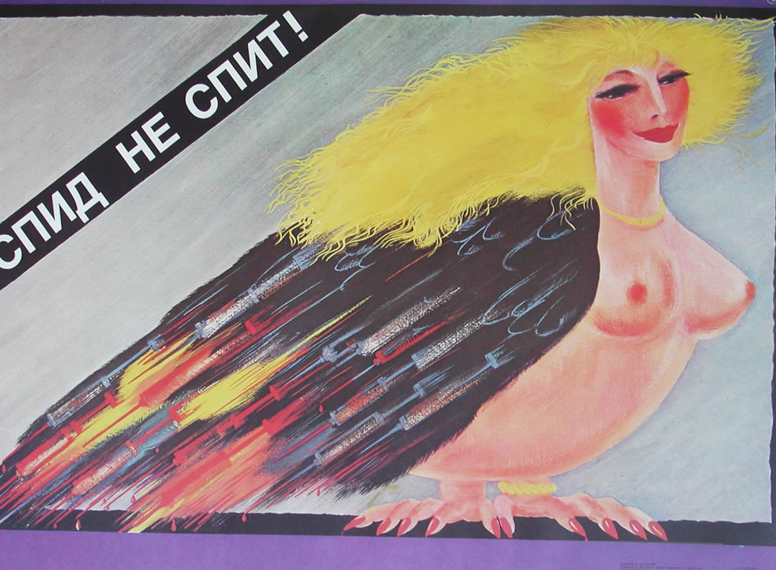 Prostitute in shape of bird w/wings made of needles; red, blue, yellow, black