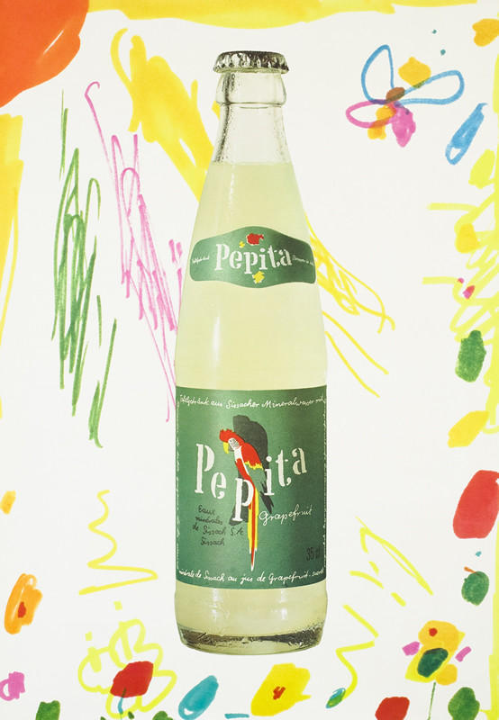 A bottle of Eptinger, childish drawing in background; green, yellow