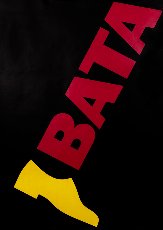 Shoe connected to leg made up of the RED letters with yellow shoe BATA; black,  red