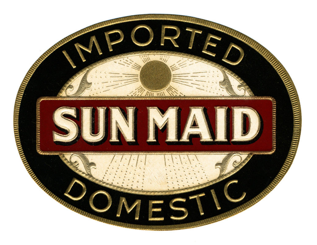 Sun maid is written in gold across the center on a red background with a sun behind; gold, red, black, white