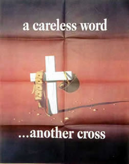 A helmet and ammo belt hang on a white cross; brown