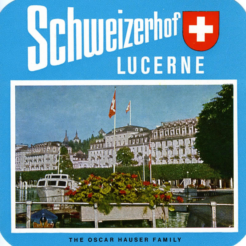 Picturesque view of hotel from the boat docks; blue, red, green