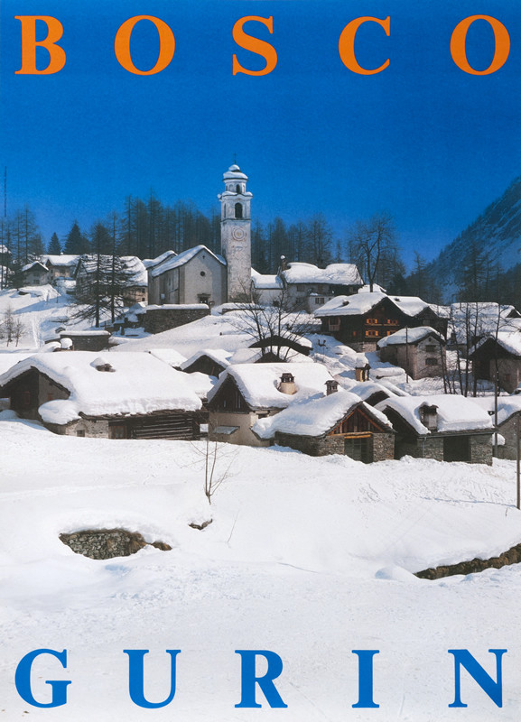 Blue sky above village nestled in snow; blue, white