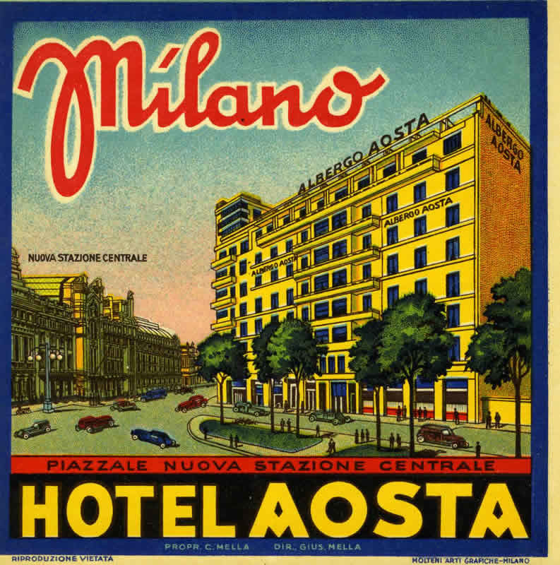 Street view of hotel pictured with cetral station; blue, yellow, red