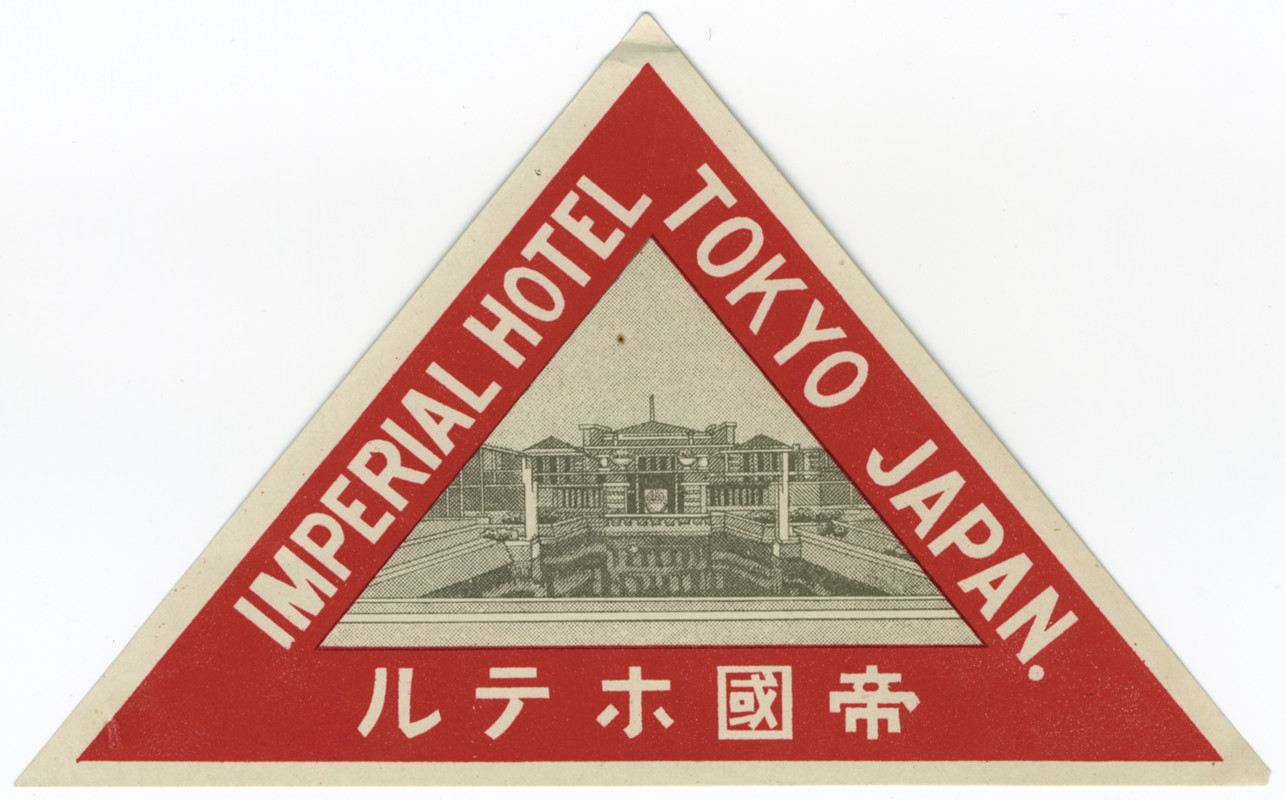 Drawing of hotel surrounded by English and Japanese text; red, white