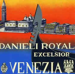 Gondola in foreground with view of Venice behind; orange, yellow, blue