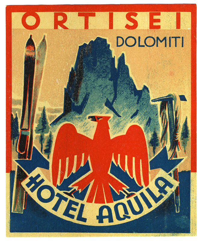 Crest with bird, mountain climbing axe, skis and mountain peak in background; red, blue, white, pink