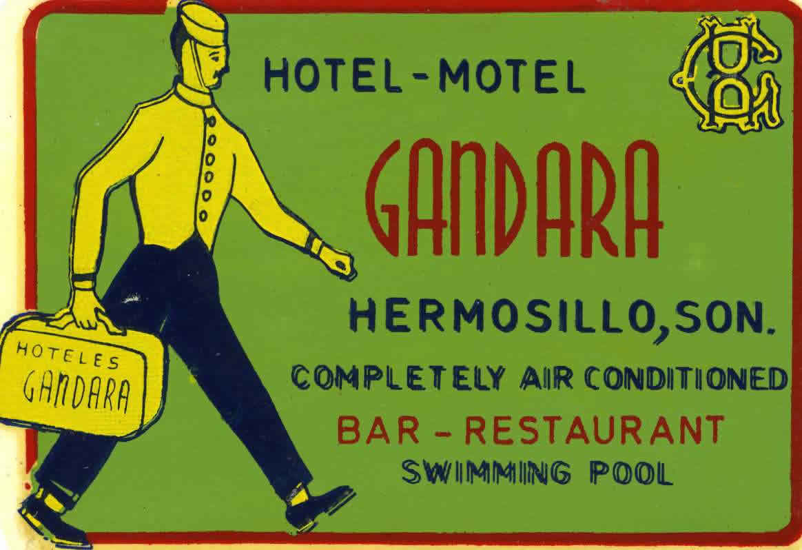 Image of bellboy carrying luggage with hotel name on it; green, blue, red, yellow