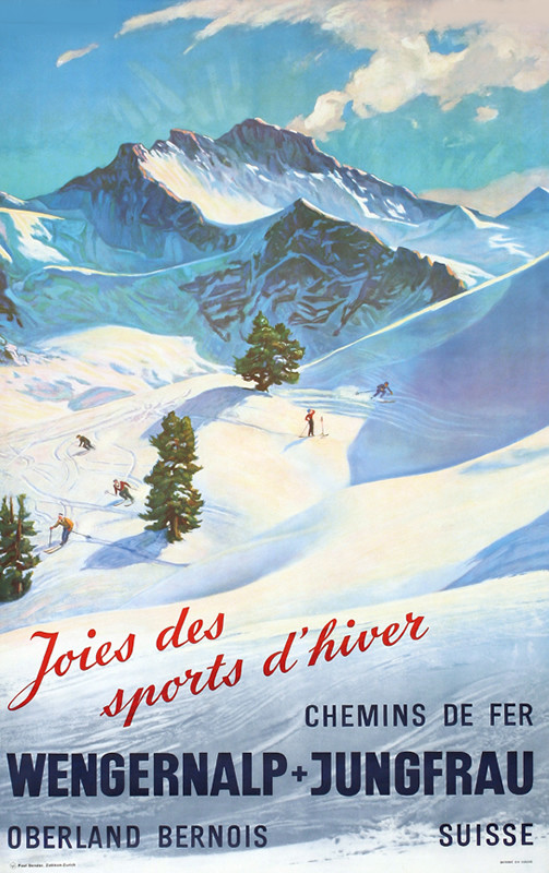 Skiers skiing down mountain slopes