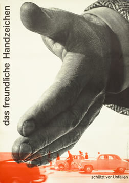 Giant hand extends over traffic; orange, black and white