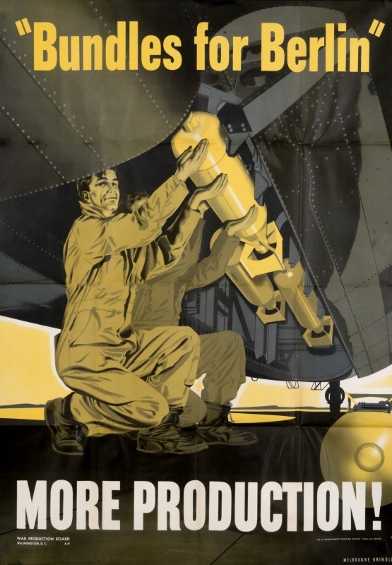 Men load bombs into undercarriage of airplane; brown, yellow, gray