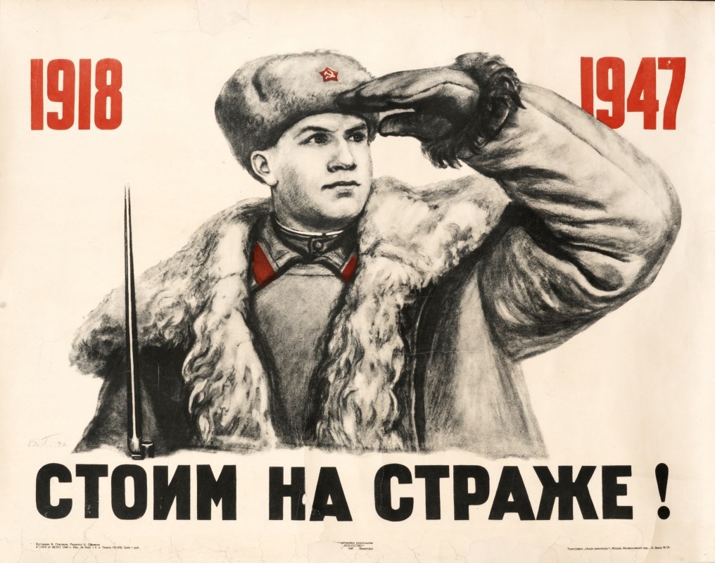 soldier in winter uniform looks in distance; white, black, red