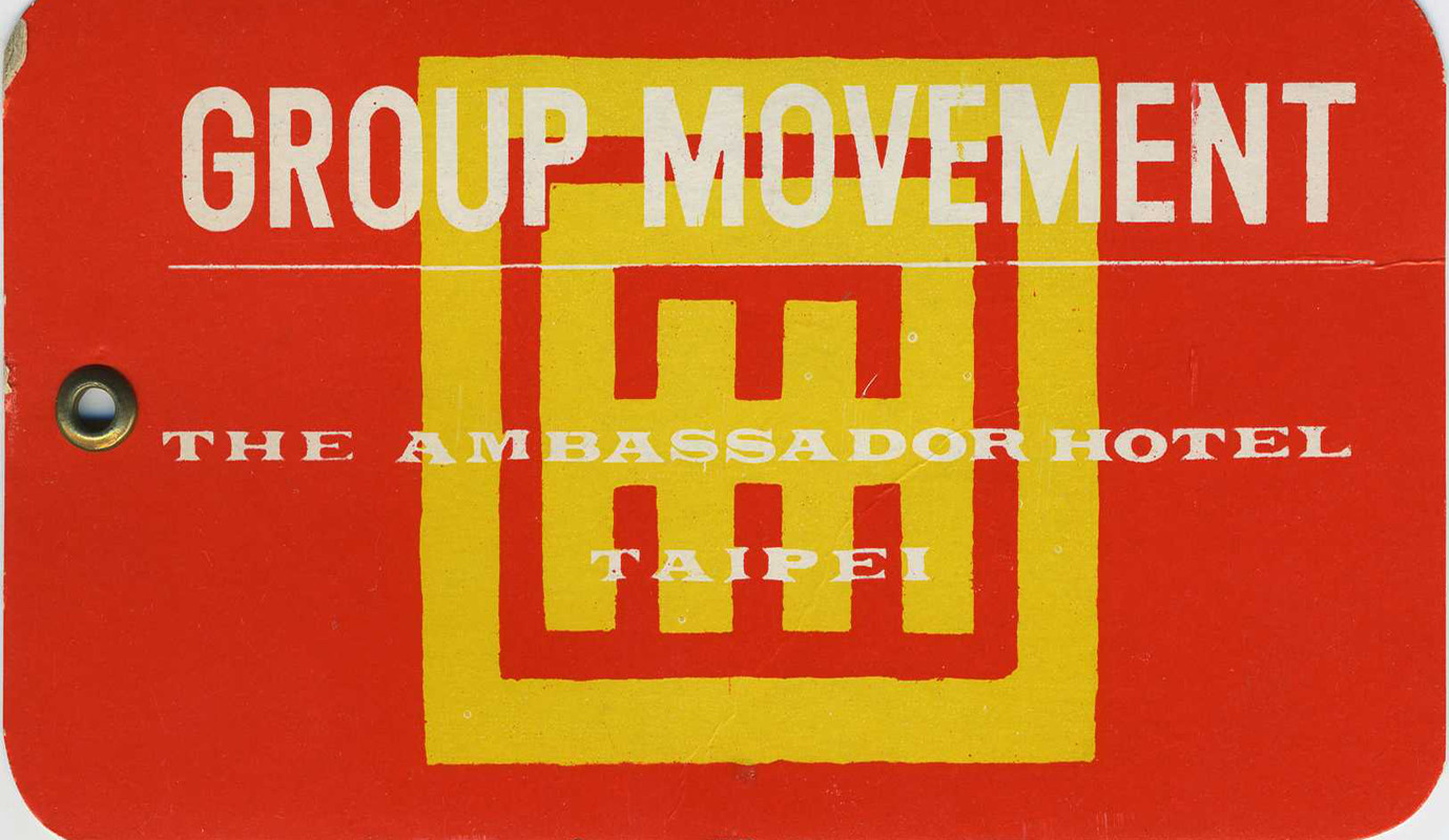 Hotel emblem, tag is to signify which luggage belongs to which group; red, yellow