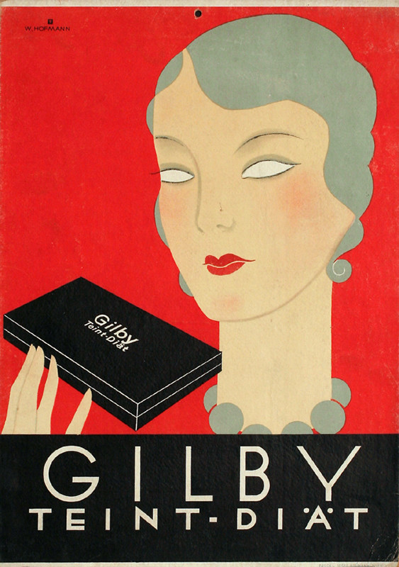 Woman with fashionable gray coiffure regards box of dye; orange, gray, black