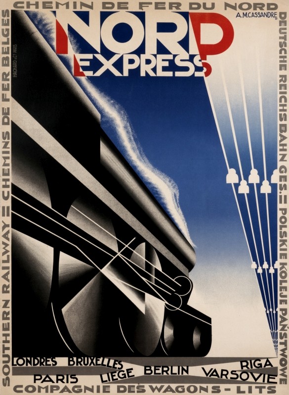 Train steams down the track; red, black, blue