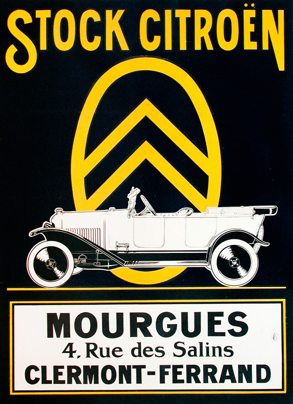 Car in profile against black background and yellow chevron logo; black, yellow