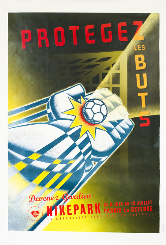 Futuristic goalie's mitt extends to block ball from entering goal; red, green, blue, yellow